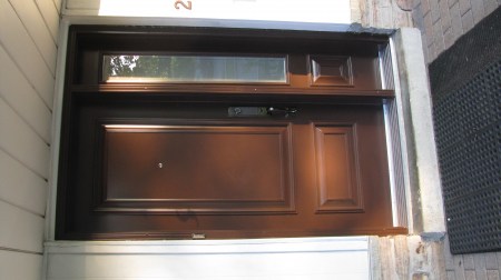 Raised panels on chestnut brown door